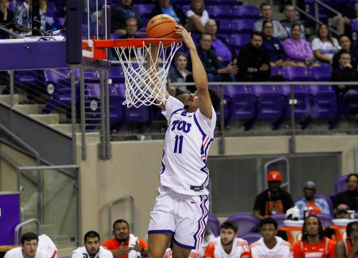 TCU guard Treyvion Tennyson slams the ball into the basket at Ed and Rae Schollmaier Arena in Fort Worth, Texas on November 14th, 2023. The TCU Horned Frogs beat the UTRGV Vaqueros 88-55. (TCU360/Tyler Chan)