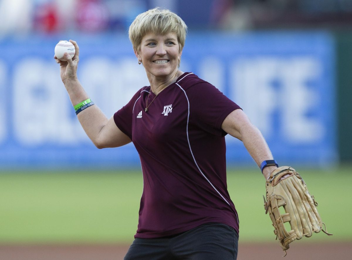 Charean Williams, award winner from the Professional Football Writers of America, and Pro Football Hall of Fame inductee, throws out a first pitch before a baseball game between the Colorado Rockies and Texas Rangers, Friday, June 15, 2018, in Arlington, Texas.