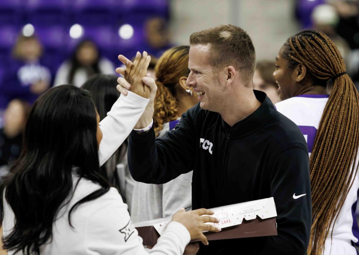 TCU Womens Basketball Head Coach Mark Campbell celebrates the win at Ed and Rae Schollmaier Arena in Fort Worth, Texas on December 1st, 2023. The TCU Horned Frogs beat the Tulsa Golden Hurricane 82-50. (TCU360/ Tyler Chan)