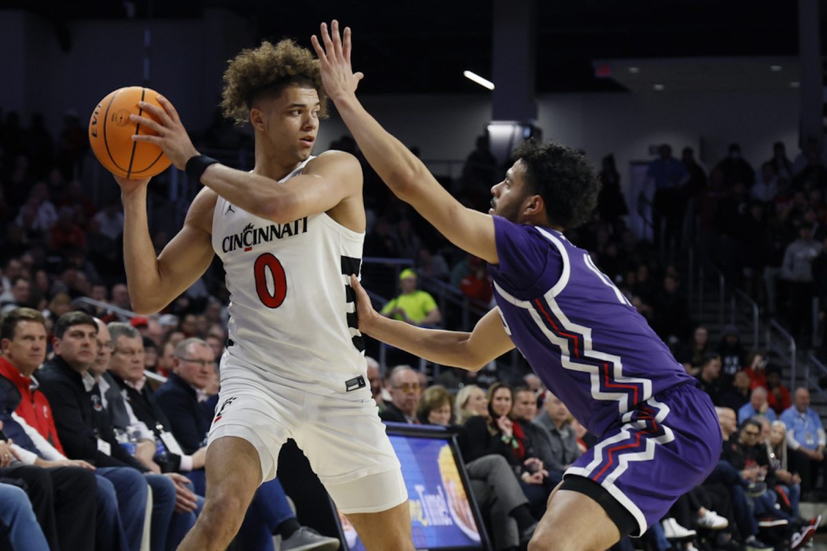 Cincinnatis Dan Skillings, left, looks for an open pass as TCUs Trevian Tennyson defends. Skillings missed two free throws that could have ended the game in regulation, but he put the Bearcats ahead late in overtime. (AP Photo/Jay LaPrete)