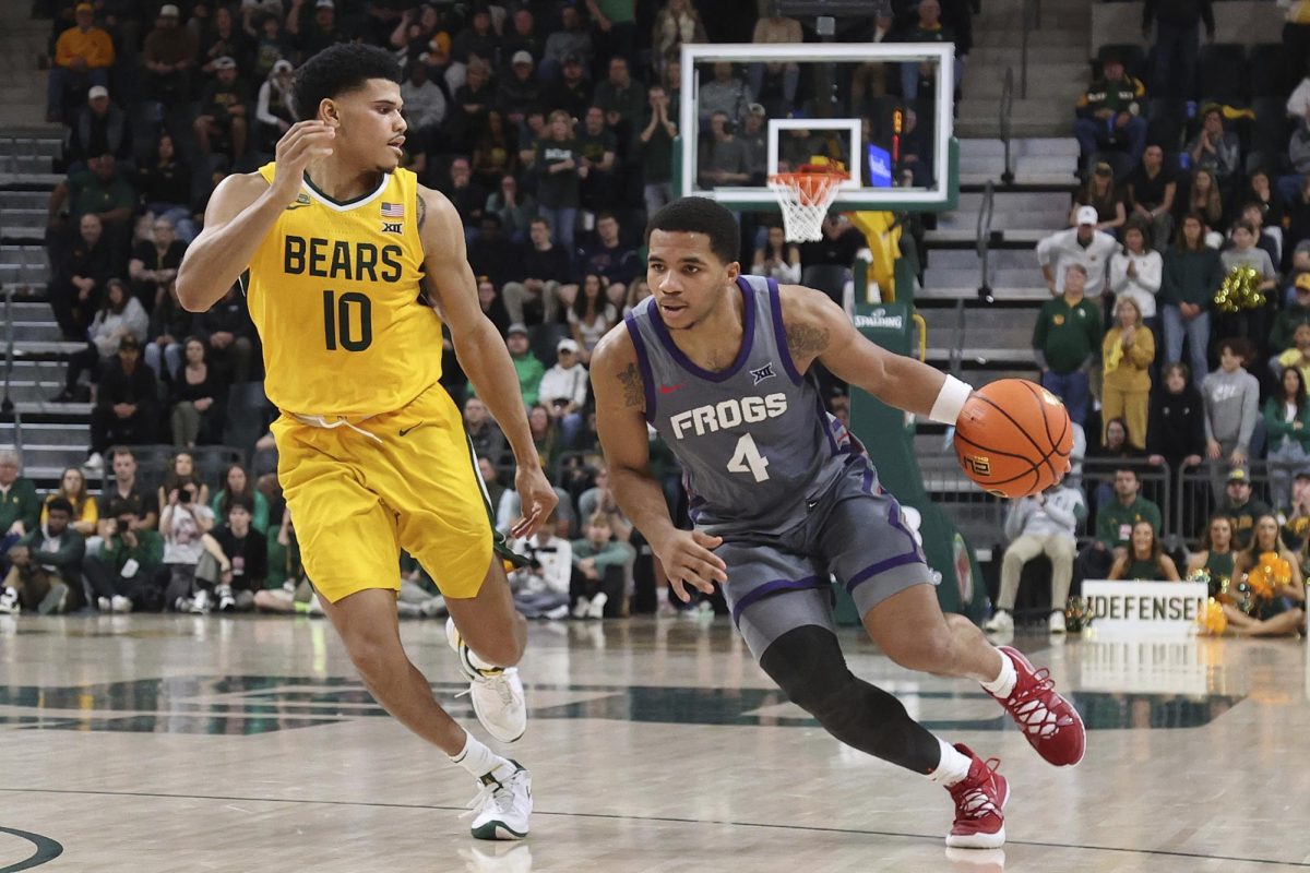 TCU guard Jameer Nelson Jr. (4) drives the ball against Baylor guard RayJ Dennis (10) during the second half of an NCAA college basketball game Saturday, Jan. 27, 2024, in Waco, Texas. (AP Photo/Jerry Larson)