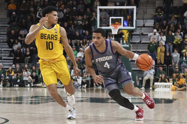 TCU guard Jameer Nelson Jr. (4) drives the ball against Baylor guard RayJ Dennis (10) during the second half of an NCAA college basketball game Saturday, Jan. 27, 2024, in Waco, Texas. (AP Photo/Jerry Larson)