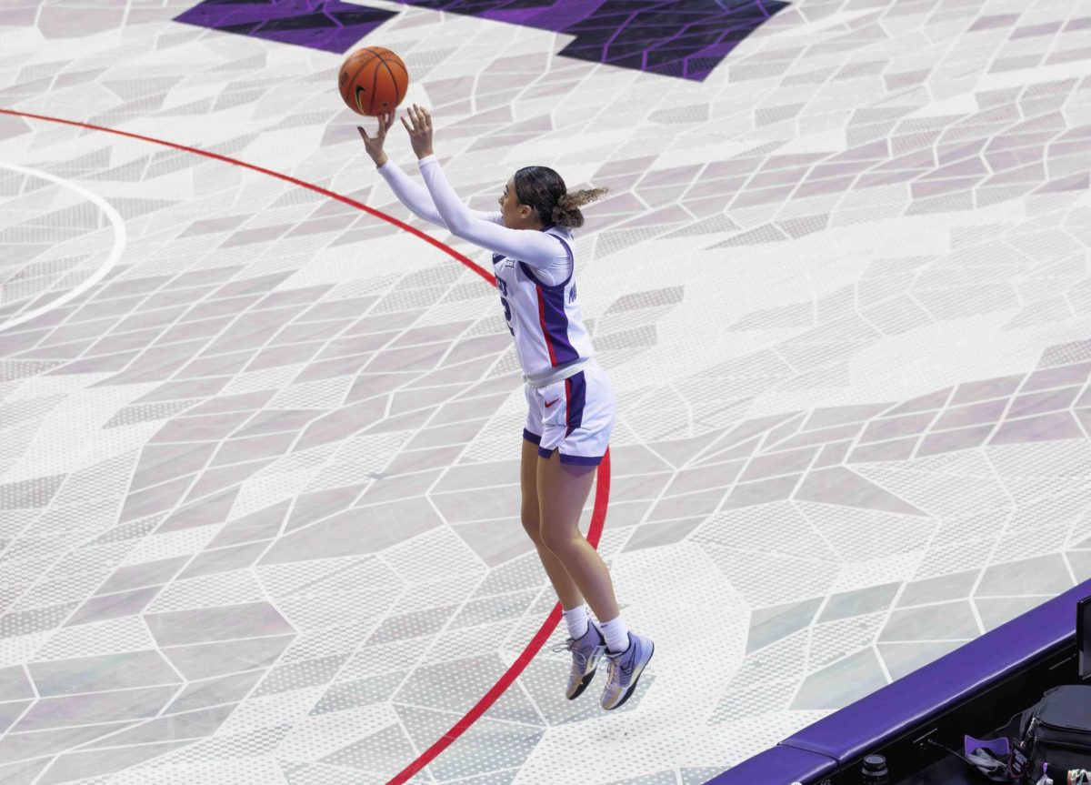 TCU Guard Tara Manumaleuga shoots a three pointer at Ed and Rae Schollmaier Arena in Fort Worth, Texas on January 23rd, 2024. The TCU Horned Frogs beat the UCF Knights 66-60. (TCU360/Tyler Chan)