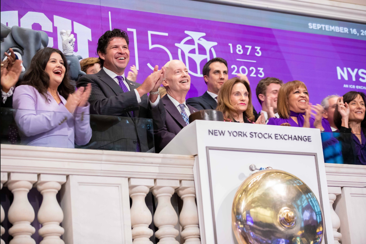 Marina Magnant at the New York Stock Exchange alongside Chancellor Boschini, President Pullin and others. 
