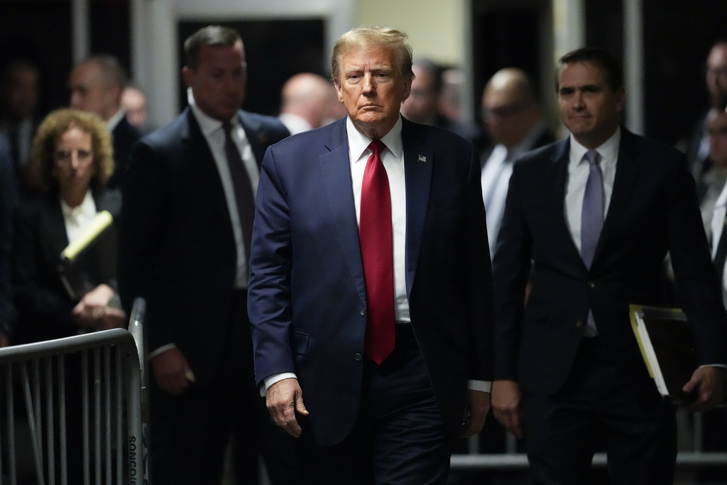 Former President Donald Trump leaves Manhattan criminal court, Thursday, Feb. 15, 2024, in New York. A New York judge says Trumps hush-money trial will go ahead as scheduled with jury selection starting on March 25.  (AP Photo/Mary Altaffer)