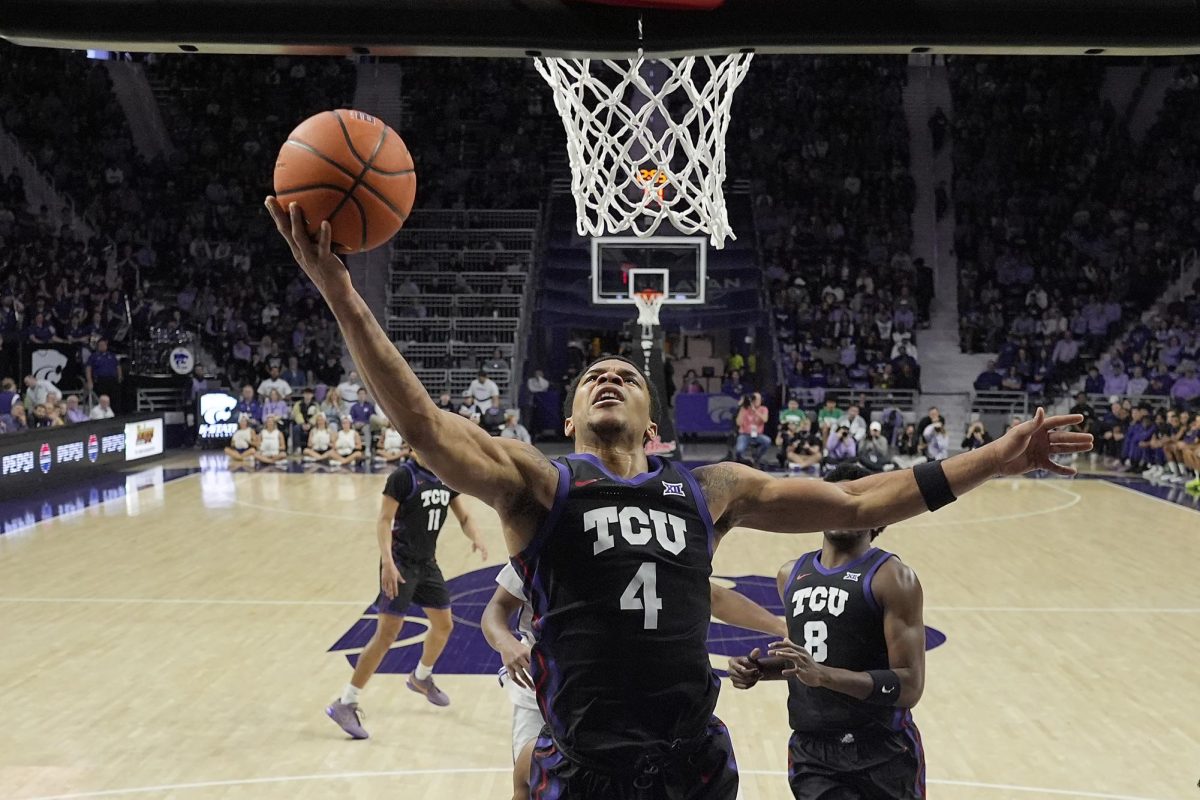 TCU guard Jameer Nelson Jr. (4) puts up a shot during the first half of an NCAA college basketball game against Kansas State Saturday, Feb. 17, 2024, in Manhattan, Kan. (AP Photo/Charlie Riedel)