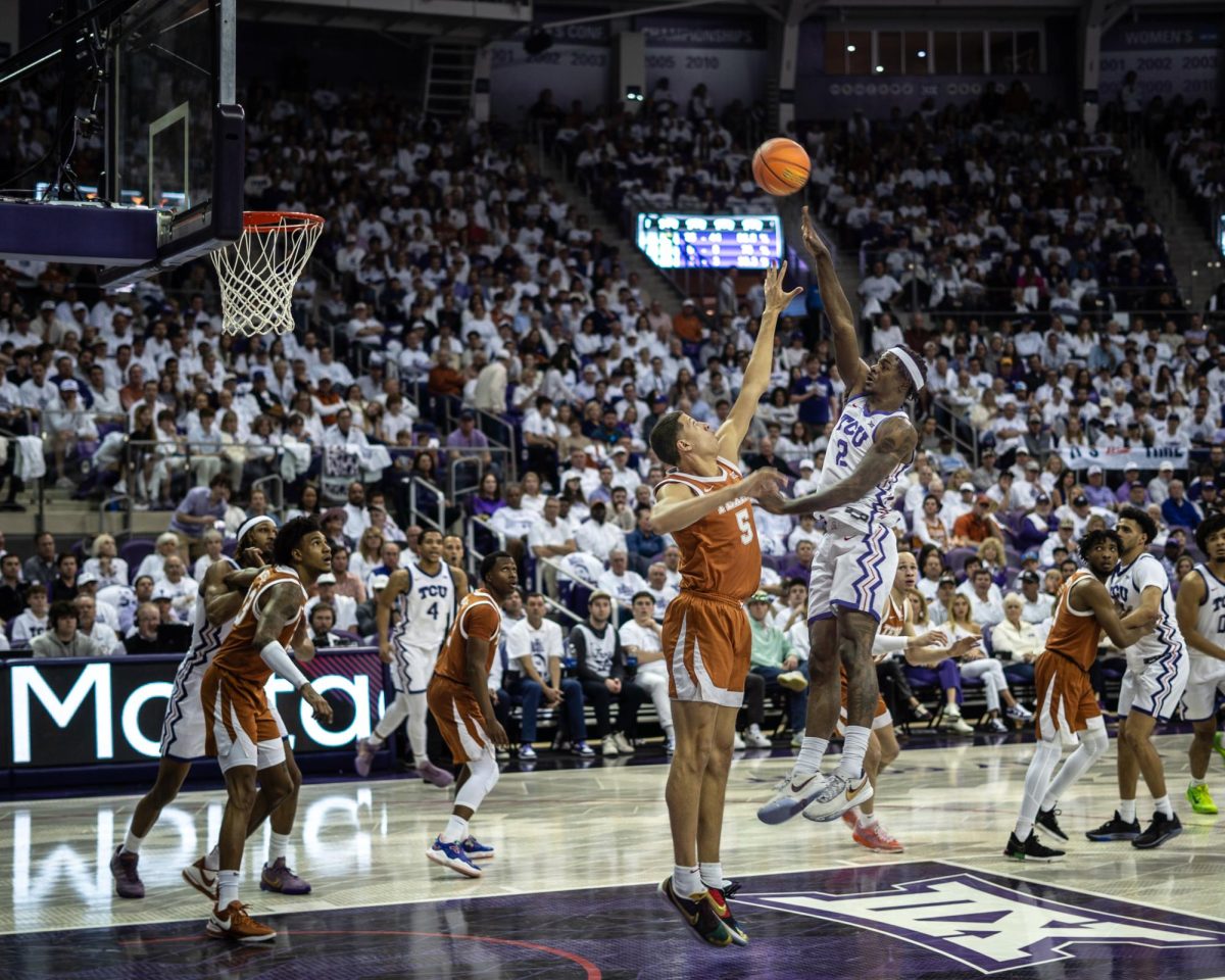 TCU guard forward Emanuel Miller shoots over a defender at Ed and Rae Schollmaier Arena, Feb. 3, 2024. The TCU Horned Frogs lost to the Texas Longhorns 66-77. (TCU 360/ Shane Manson)