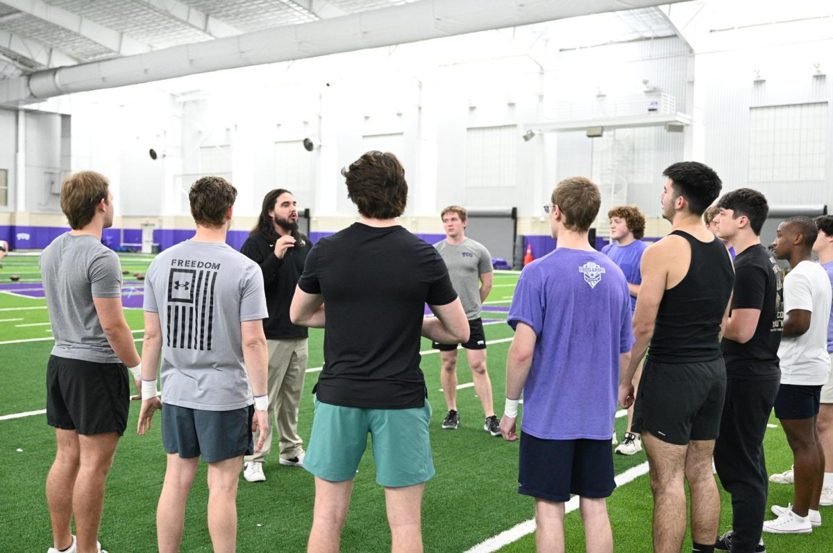 Male hopefuls for the TCU cheer team gathered for an open practice with the team, Tuesday, Jan. 13, 2024. (Crystal Polglase/Staff Photographer)