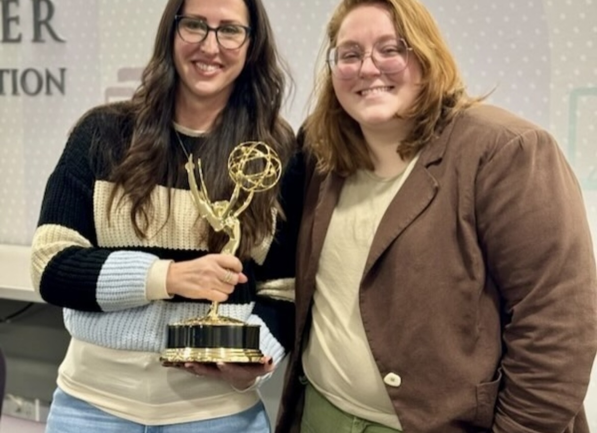 Professor Tricia Jenkins holds alumna Emily Mendez’s Emmy award in the Moudy South lobby on Tuesday, Jan. 23, 2024. (Photo courtesy of Tricia Jenkins)