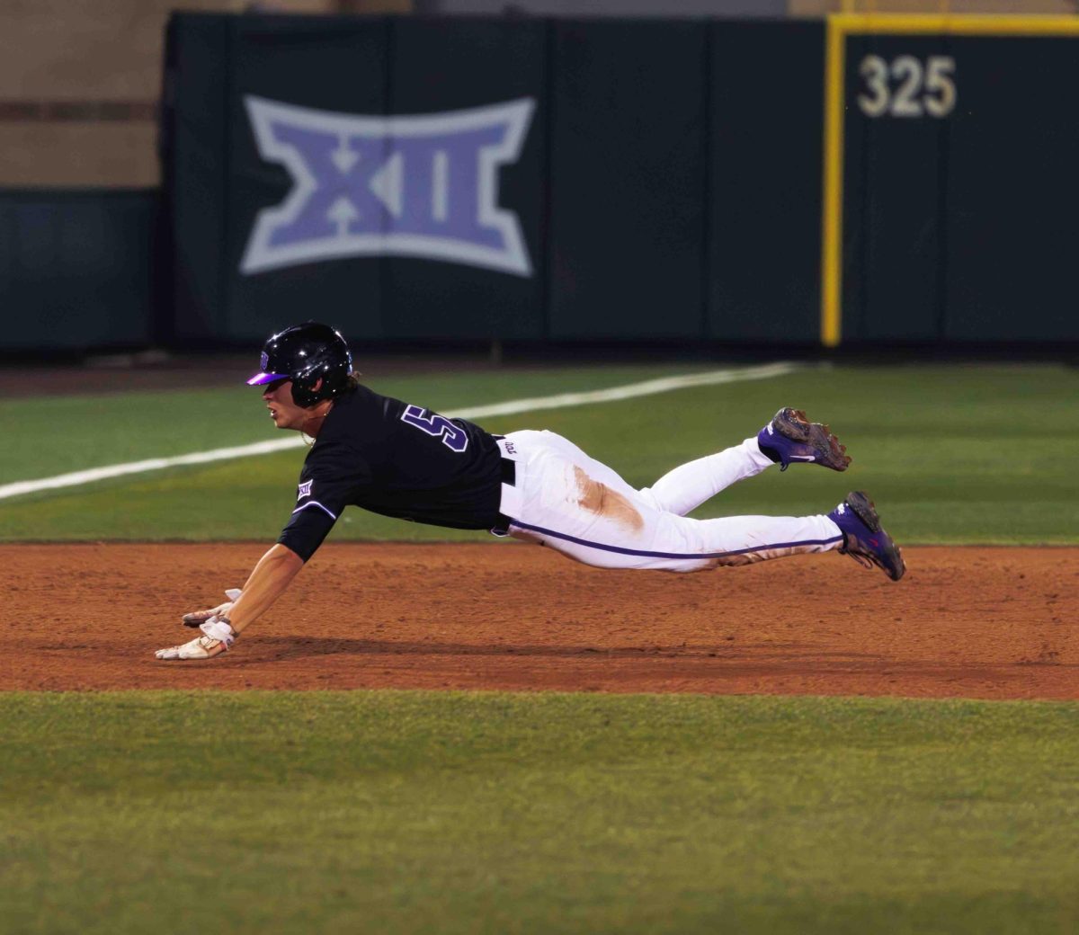 TCU shortstop Anthony Silva dives headfirst into third base at Lupton Stadium in Fort Worth, Texas on Feb. 27, 2024. The TCU Horned Frogs beat the Washington State Cougars 8-7 in 12 innings. (TCU360/Tyler Chan)