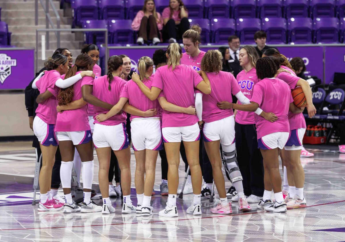 The TCU Womens Basketball team huddles up during warm ups at Ed and Rae Schollmaier Arena in Fort Worth, Texas on February 13th, 2024. The TCU Horned Frogs fell to the West Virginia Mountaineers 77-52. (TCU360/ Tyler Chan)
