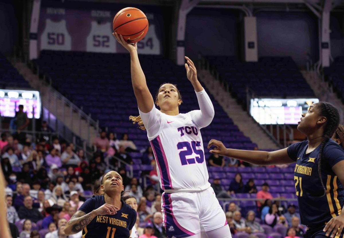 TCU forward Sydney Harris goes up for a shot at Ed and Rae Schollmaier Arena in Fort Worth, Texas on February 13th, 2024. The TCU Horned Frogs fell to the West Virginia Mountaineers 77-52. (TCU360/ Tyler Chan)