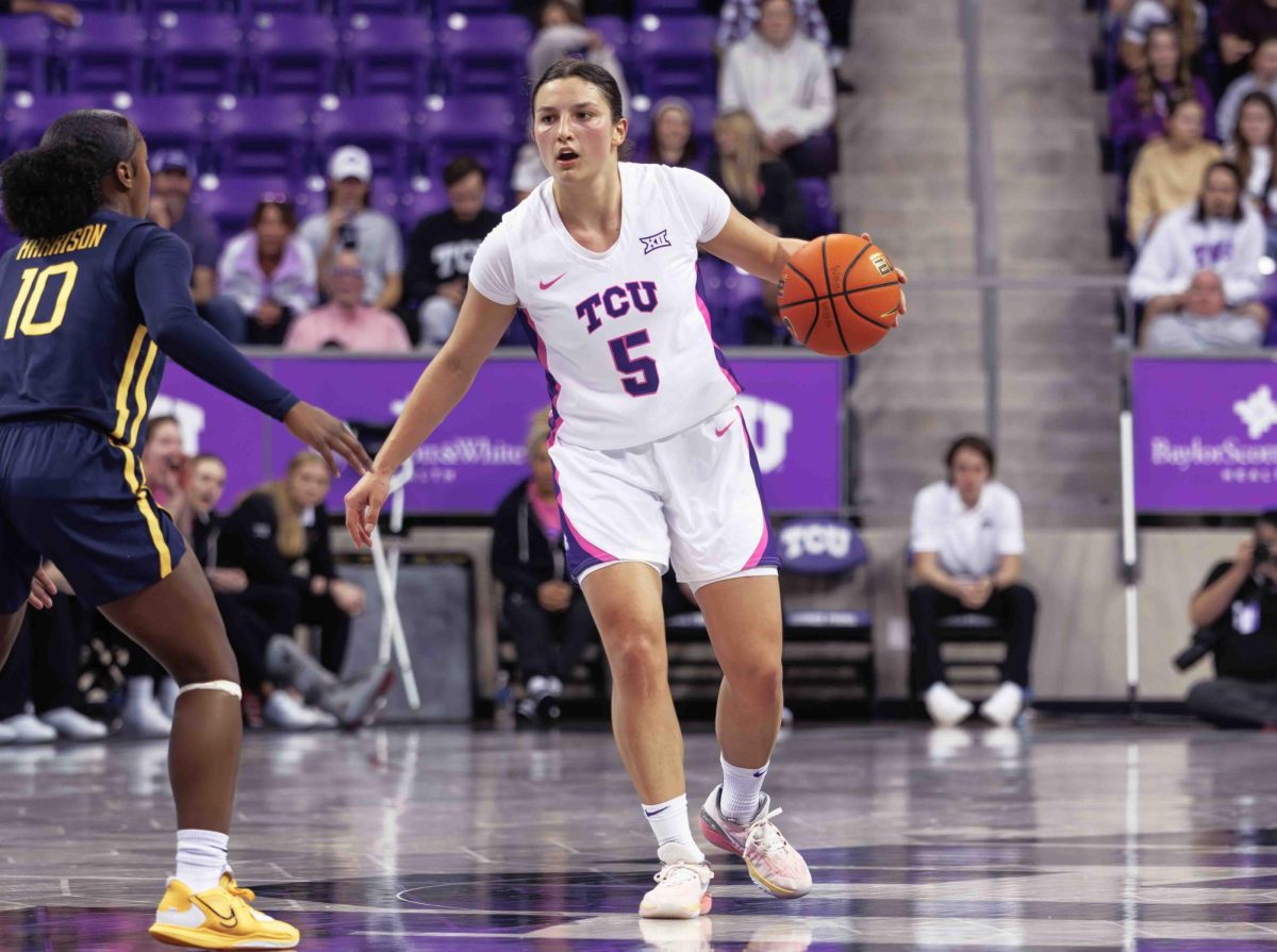TCU guard Una Jovanovic dribbles the ball at Ed and Rae Schollmaier Arena in Fort Worth, Texas on February 13th, 2024. The TCU Horned Frogs fell to the West Virginia Mountaineers 77-52. (TCU360/ Tyler Chan)