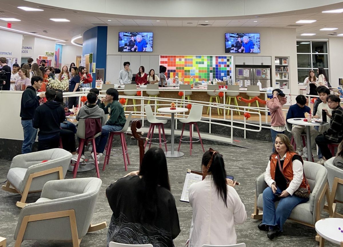 Students, faculty, staff and alumni gather inside the TCU intercultural center for Lunar New Year’s celebrations on Feb. 9, 2024. (Zahra Ahmad/Staff Photographer)  