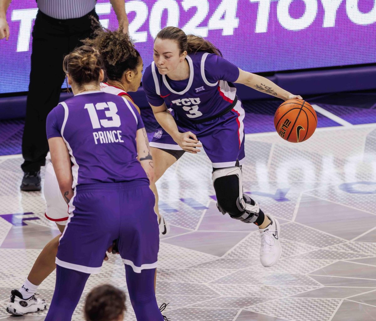 TCU guard Madison Conner dribbles the ball around the screen at Ed and Rae Schollmaier Arena in Fort Worth, Texas on February 28th, 2024. The TCU Horned Frogs beat the Texas Tech Lady Raiders 73-52. (TCU360/ Tyler Chan)