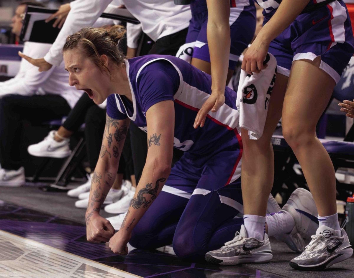 TCU center Sedona Prince celebrates her teammate making a shot at Ed and Rae Schollmaier Arena in Fort Worth, Texas on February 28th, 2024. The TCU Horned Frogs beat the Texas Tech Lady Raiders 73-52. (TCU360/ Tyler Chan)