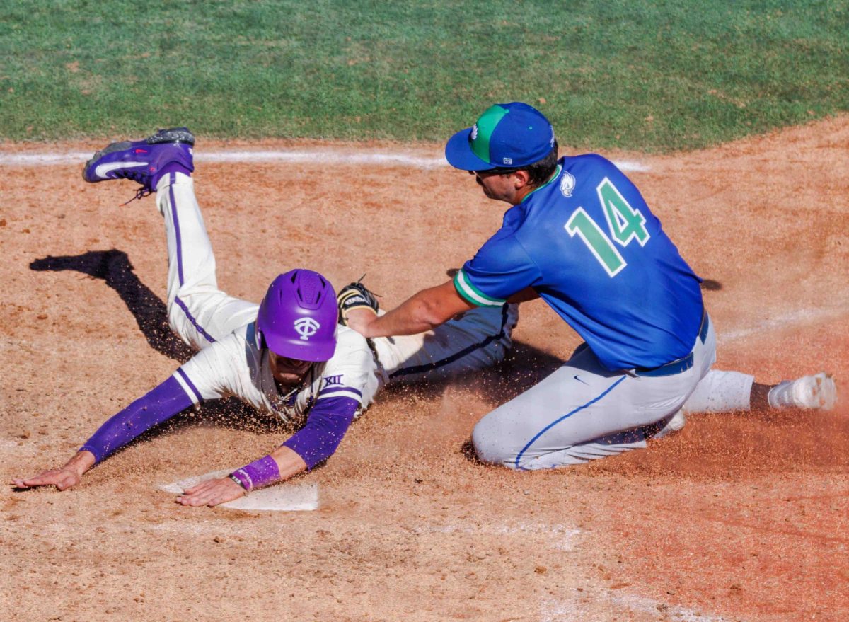 TCU third baseman Brody Green slides into home at Lupton Stadium in Fort Worth, Texas on February 18th, 2024. The TCU Horned Frogs beat the Florida Gulf Coast Eagles 11-6. (TCU360/ Tyler Chan) 