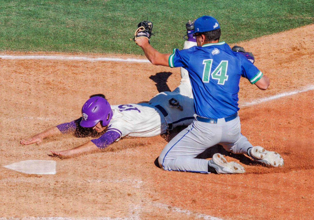 TCU outfielder Chase Brunson slides into home at Lupton Stadium in Fort Worth, Texas on February 18th, 2024. The TCU Horned Frogs beat the Florida Gulf Coast Eagles 11-6. (TCU360/ Tyler Chan)