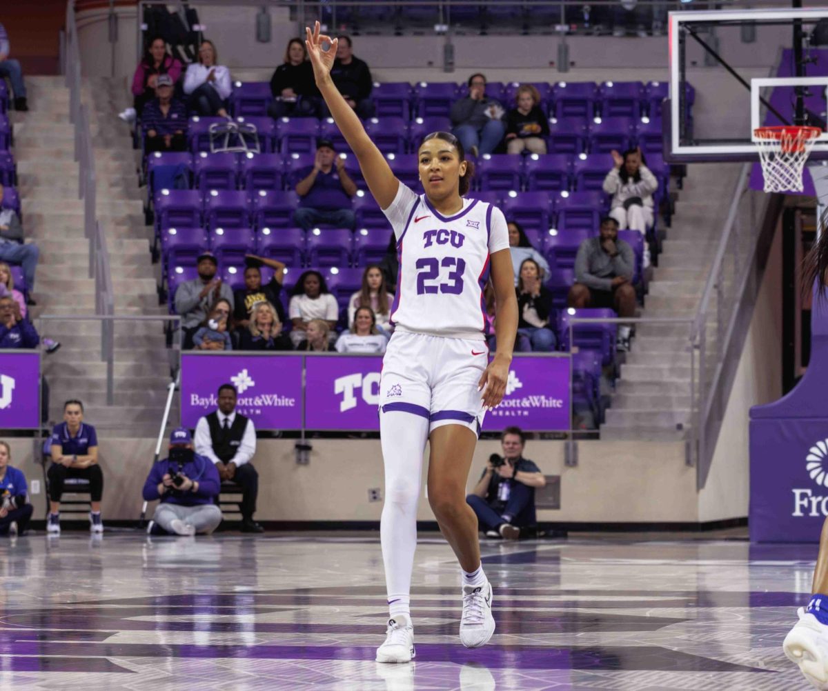 TCU forward Aaliyah Robinson celebrates making a three pointer at Ed and Rae Schollmaier Arena in Fort Worth, Texas on February 3, 2024. The TCU Horned Frogs fell to the Kansas Jayhawks 74-81. (TCU360/ Tyler Chan)