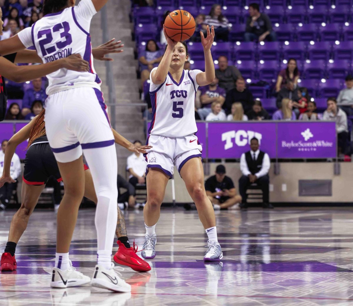 TCU guard Una Jovanovic passes the ball at Ed and Rae Schollmaier Arena in Fort Worth, Texas on February 24th, 2024. The TCU Horned Frogs beat the Houston Cougars 59-49. (TCU360/ Tyler Chan)