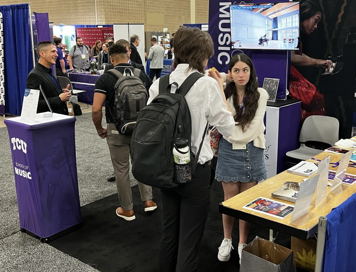 The TCU School of Music recruits at a booth in the convention center. (@tcumusic on Instagram)