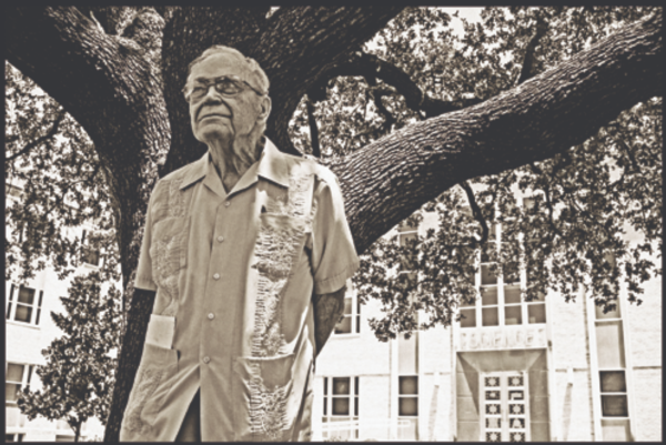 Dr. Harrison Miller Moseley stands in front of Winton-Scott Hall. (Photo Courtesy of TCU Magazine)