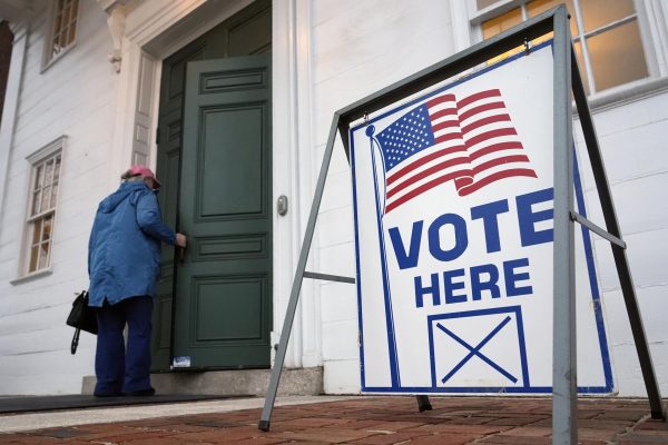 A voter prepares to vote at a polling station in Maine on Super Tuesday. 865 Republican and 1420 Democratic seats are available this Super Tuesday. (AP Photo/Michael Dwyer)