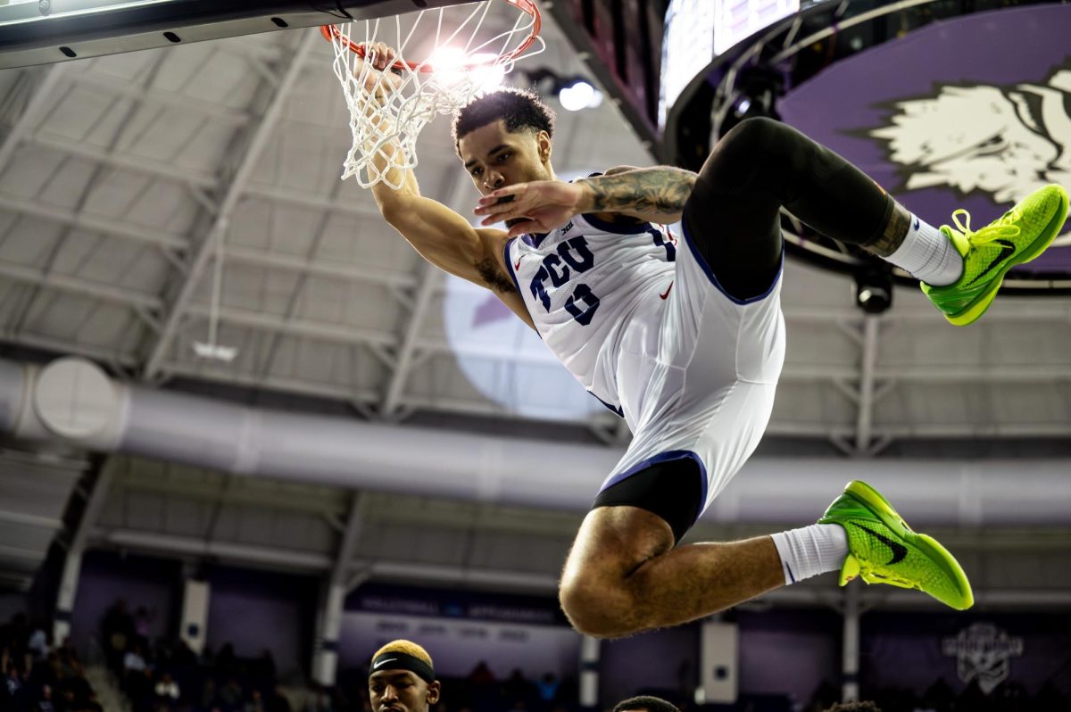 Micah Peavy dunks during pre-game warmups on March 9, Ed & Rae Schollmaier Arena. The Frogs would end up falling short against the UCF Golden Knights. 