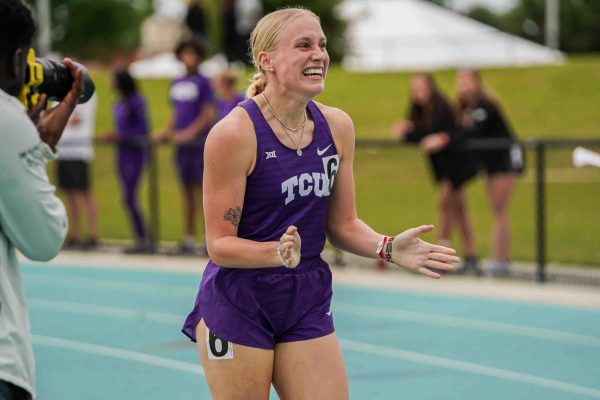 Grace Morris celebrates another successful  race in her senior season as a Horned Frog. (Photo courtesy of gofrogs.com)
