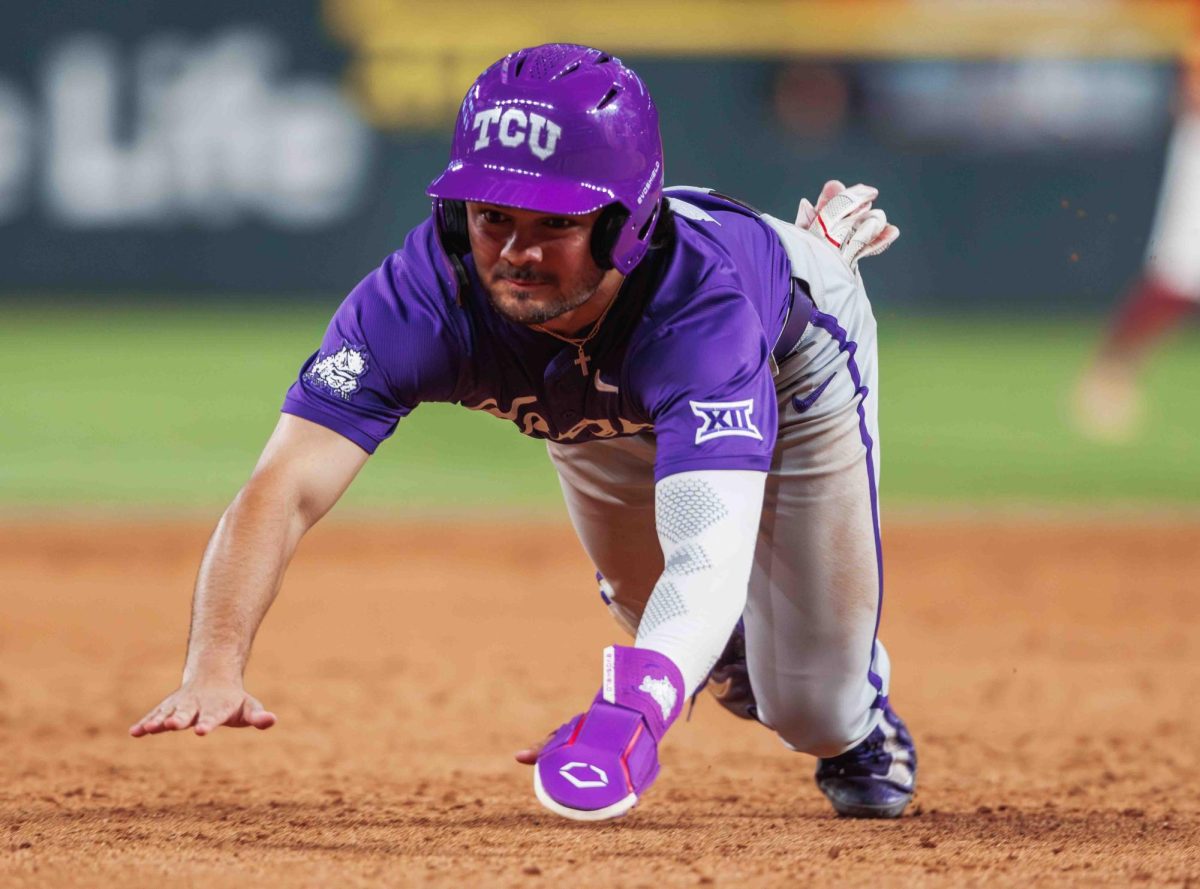 TCU outfielder Sam Myers dives head first into third base at Globe Life Field in Arlington, Texas on March 3rd, 2024. The TCU Horned Frogs beat the USC Trojans 9-5. (TCU360/Tyler Chan)