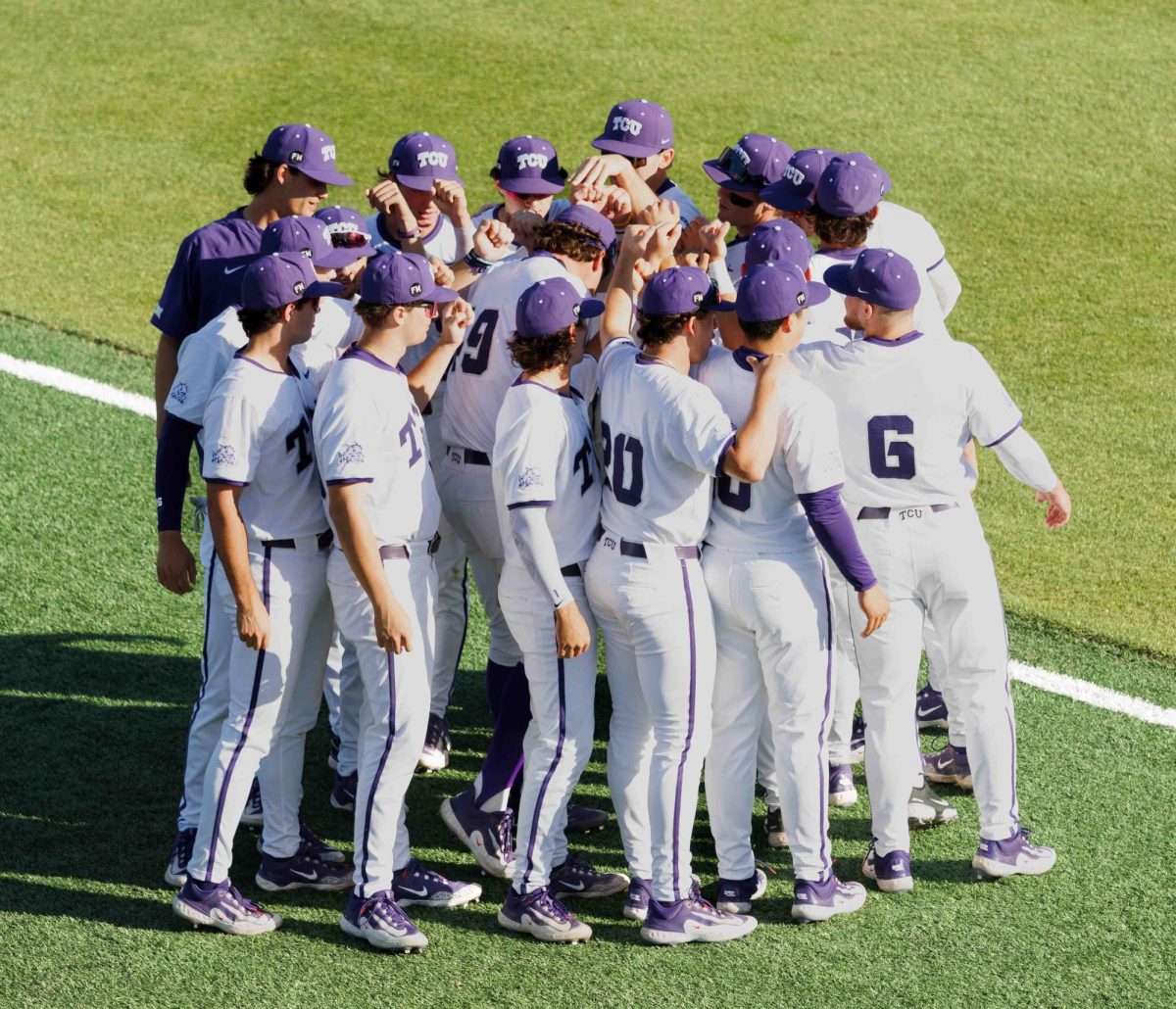 The TCU baseball team huddles up before the game at Lupton Stadium in Fort Worth, Texas on March 28th, 2024. The TCU Horned Frogs beat the Houston Cougars 14-1. (TCU360/ Tyler Chan)