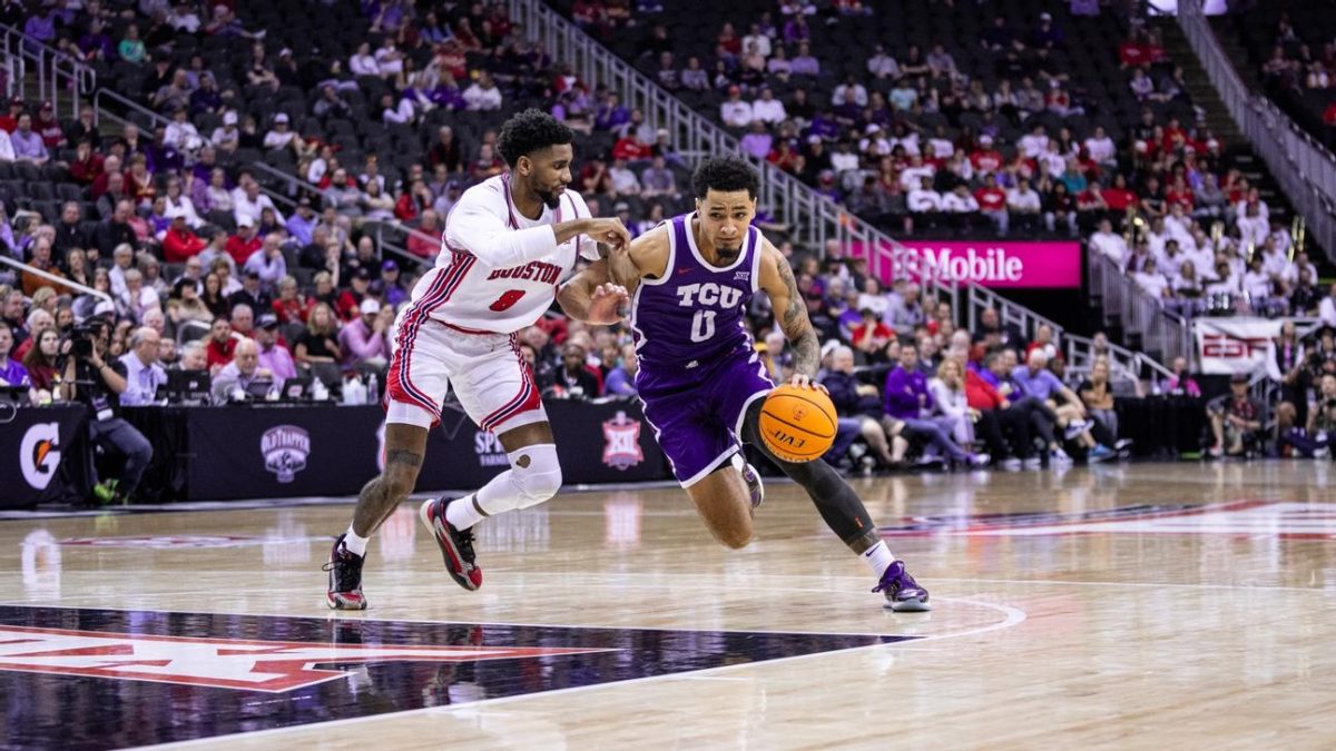 Micah Peavy drives to the basket against No. 1 Houston in the Big 12 basketball championship tournament. (Photo Courtesy of gofrogs.com)