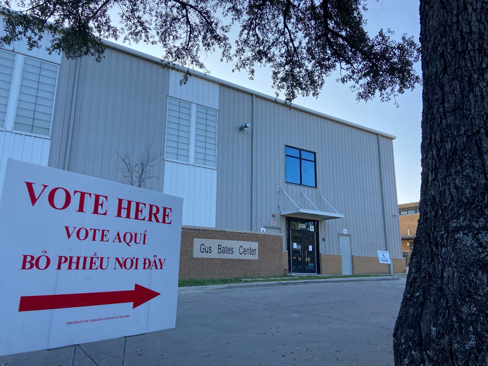 A sign outside of R.L. Paschal High School directs voters to a polling place.