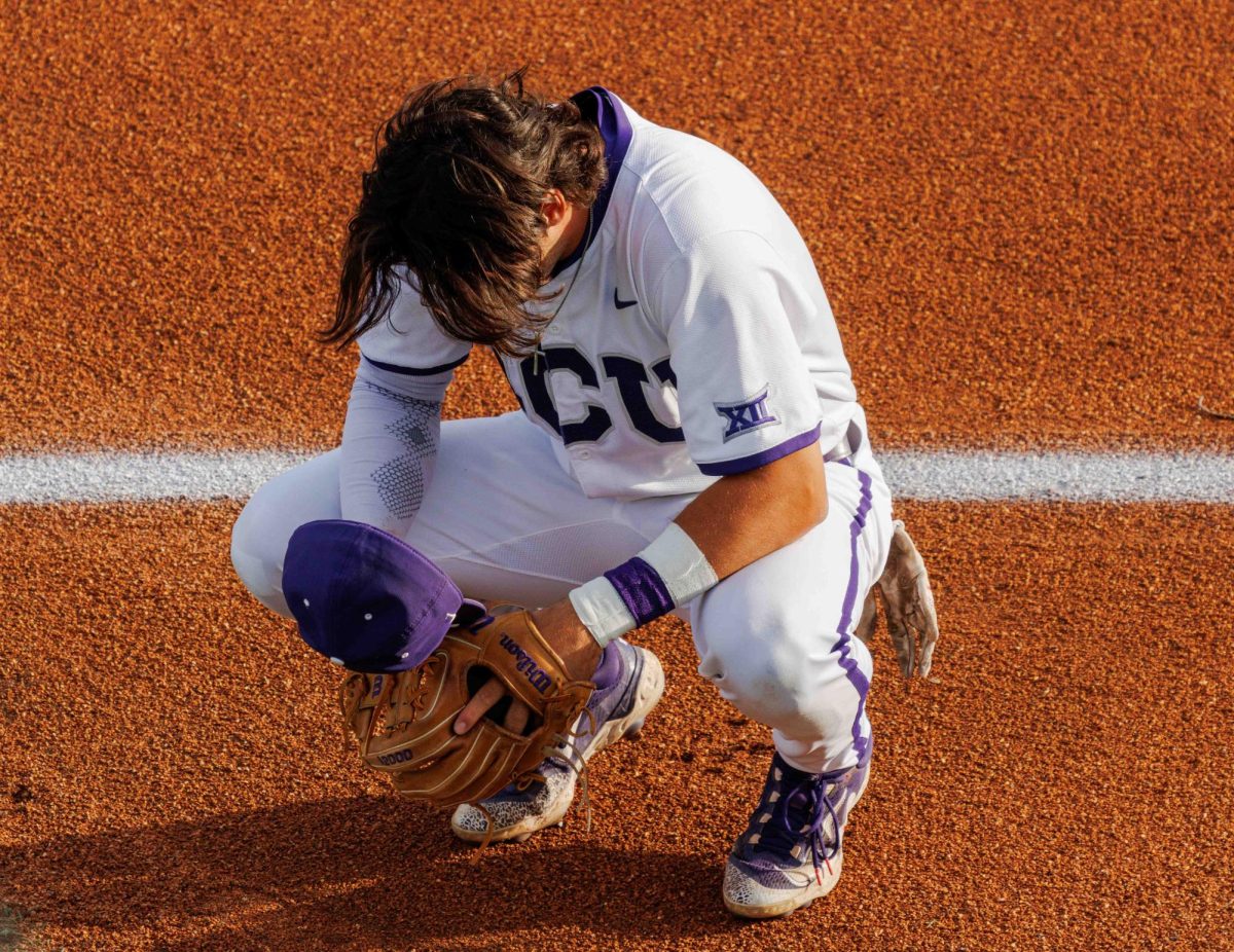 TCU third basemen Peyton Chatagnier prays before the game at Lupton Stadium in Fort Worth, Texas on April 12th, 2024. The TCU Horned Frogs fell to the Texas Tech Red Raiders 7-1. (TCU360/  Tyler Chan)