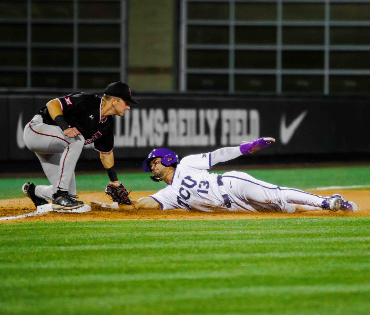 TCU outfielder Sam Myers slides into third base at Lupton Stadium in Fort Worth, Texas on April 12th, 2024. The TCU Horned Frogs fell to the Texas Tech Red Raiders 7-1. (TCU360/  Tyler Chan)