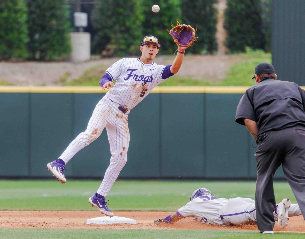 TCU shortstop Anthony Silva goes up to catch the ball before making a tag at second base at Lupton Stadium in Fort Worth, Texas on April 27th, 2024. The TCU Horned Frogs beat the Kansas State Wildcats 7-4 in game 1 of the doubleheader. (TCU360/Tyler Chan)
