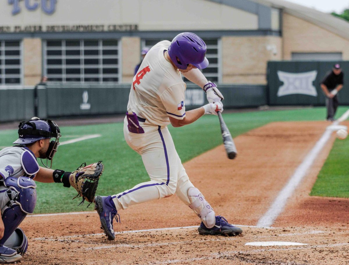 TCU catcher Kurtis Byrne hits the ballat Lupton Stadium in Fort Worth, Texas on April 27th, 2024. The TCU Horned Frogs fell to the Kansas State Wildcats 6-3 in game 2 of the doubleheader. (TCU360/Tyler Chan)