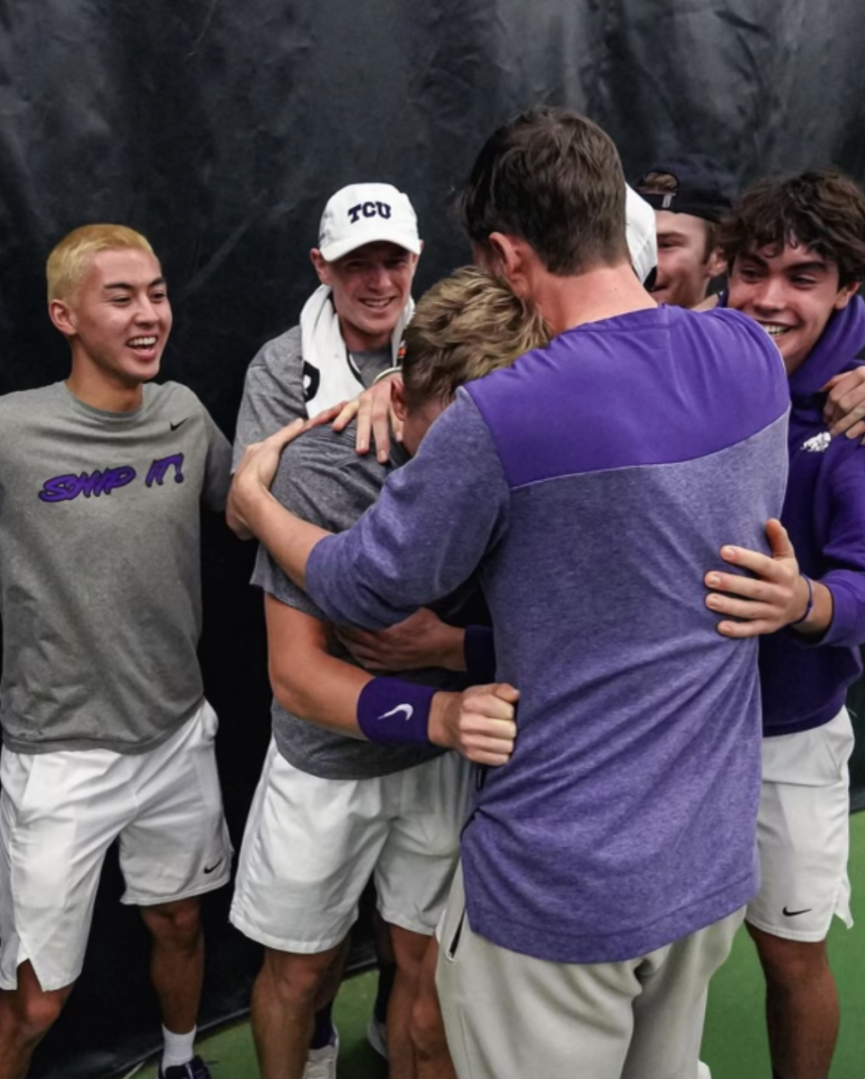 Fifth-year senior Tomas Jirousek celebrates with his team after winning the match that sealed the victory for TCU. (From @tcumenstennis)