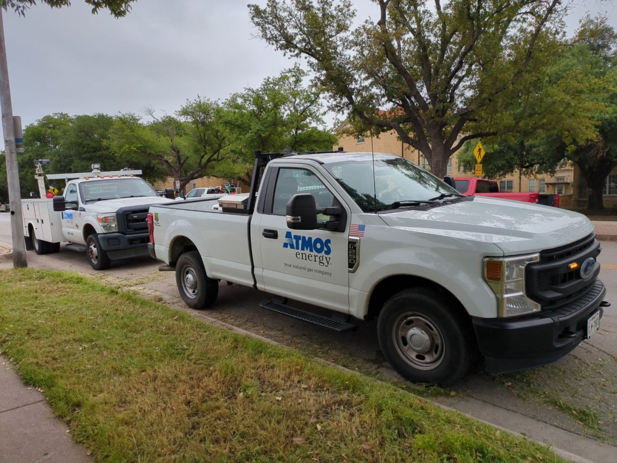 Atmos+Energy+trucks+parked+outside+of+Foster+Hall+Monday+morning.+Crews+were+on+campus+making+repairs+to+a+gas+line+behind+Jarvis+Hall.