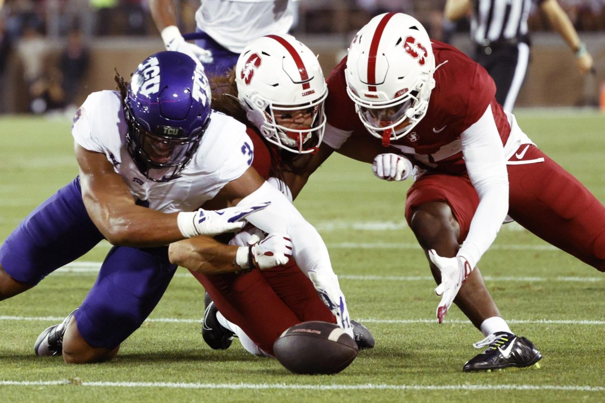 Stanford players recover their own football during an ACC football game against TCU in Stanford, Calif., Friday, Aug. 30, 2024. Santiago Mejia/San Francisco Chronicle via AP