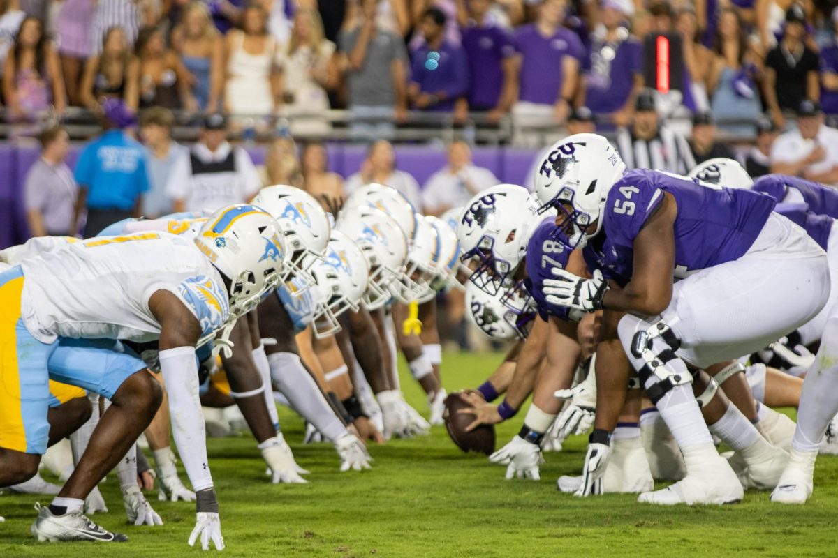 The two teams facing off during the last minute of the TCU vs LIU game. 