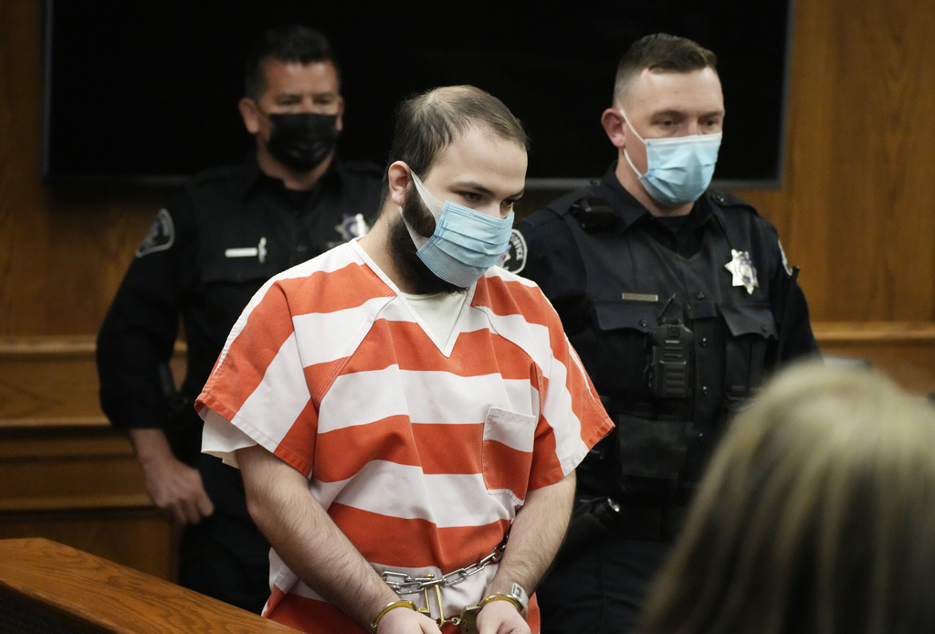 Ahmad Al Aliwi Alissa, accused of killing 10 people at a Colorado supermarket in March 2021, is led into a courtroom for a hearing, Sept. 7, 2021, in Boulder, Colo. (AP Photo/David Zalubowski, Pool, File)