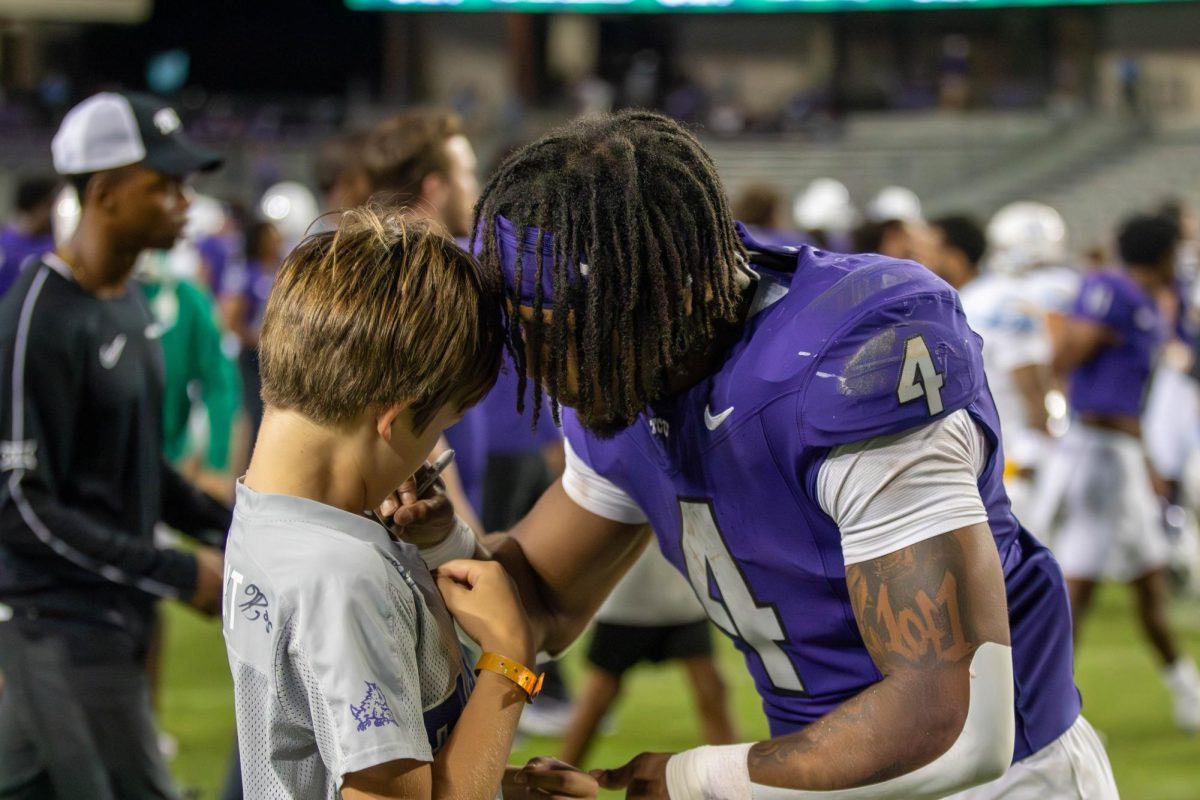 Cam Cook signed a t-shirt for a fan after a clear victory. 