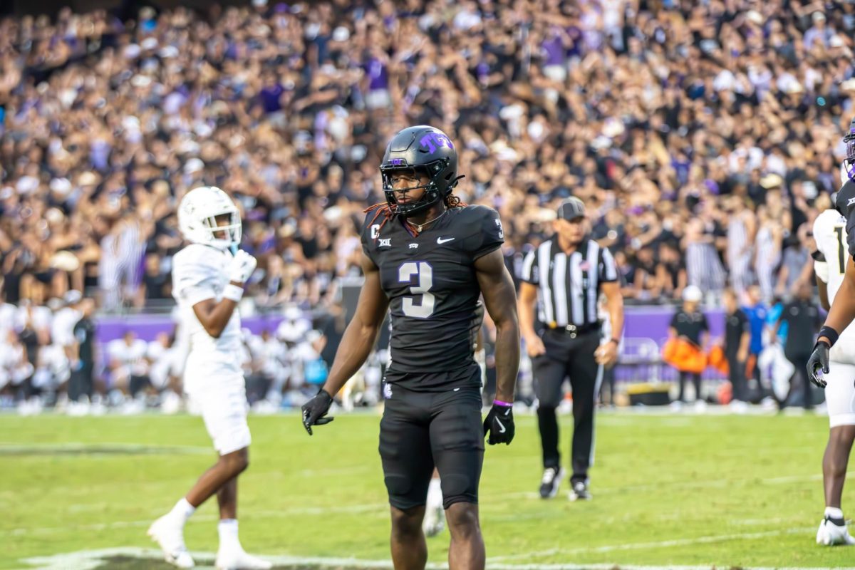 Savion Williams looking at the sideline for a play from the coach.