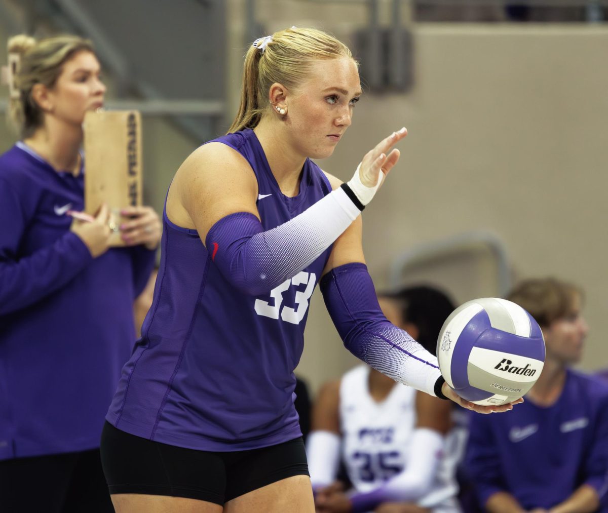 TCU Volleyball's Riley Weigelt gets ready to serve the ball at Schollmaier Arena in Fort Worth, Texas on September 20, 2024. The TCU Horned Frogs swept the Denver Pioneers 3-0.