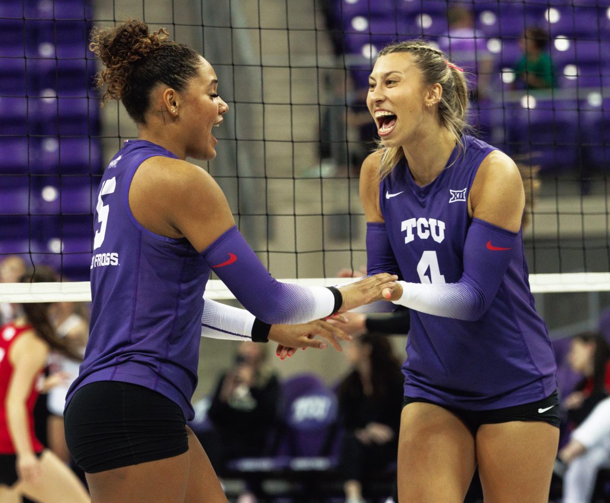 TCU Volleyball's Sarah Sylvester and Jalyn Gibson celebrate after the play at Schollmaier Arena in Fort Worth, Texas on September 20, 2024. The TCU Horned Frogs swept the Denver Pioneers 3-0. 