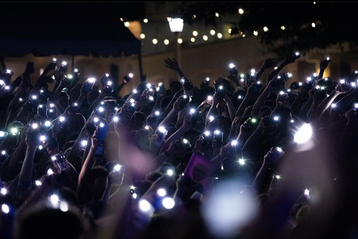 Students shine their flashlights at the Flo Rida concert in 2021. (Photo courtesy @theendtcu Instagram)