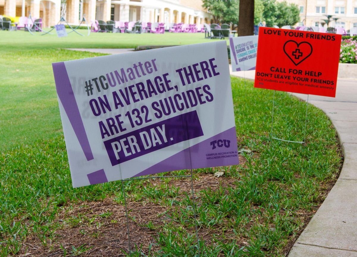 Signs are set up in the TCU campus commons to bring awareness to suicide among college students. (TCU360/ Tyler Chan)