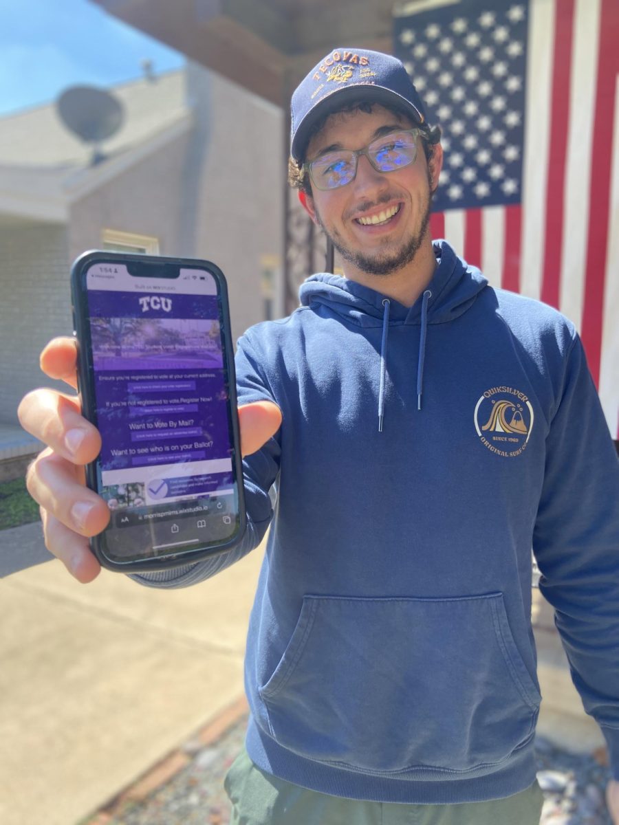 Jackson Harkness accessing the voter engagement website on his phone.