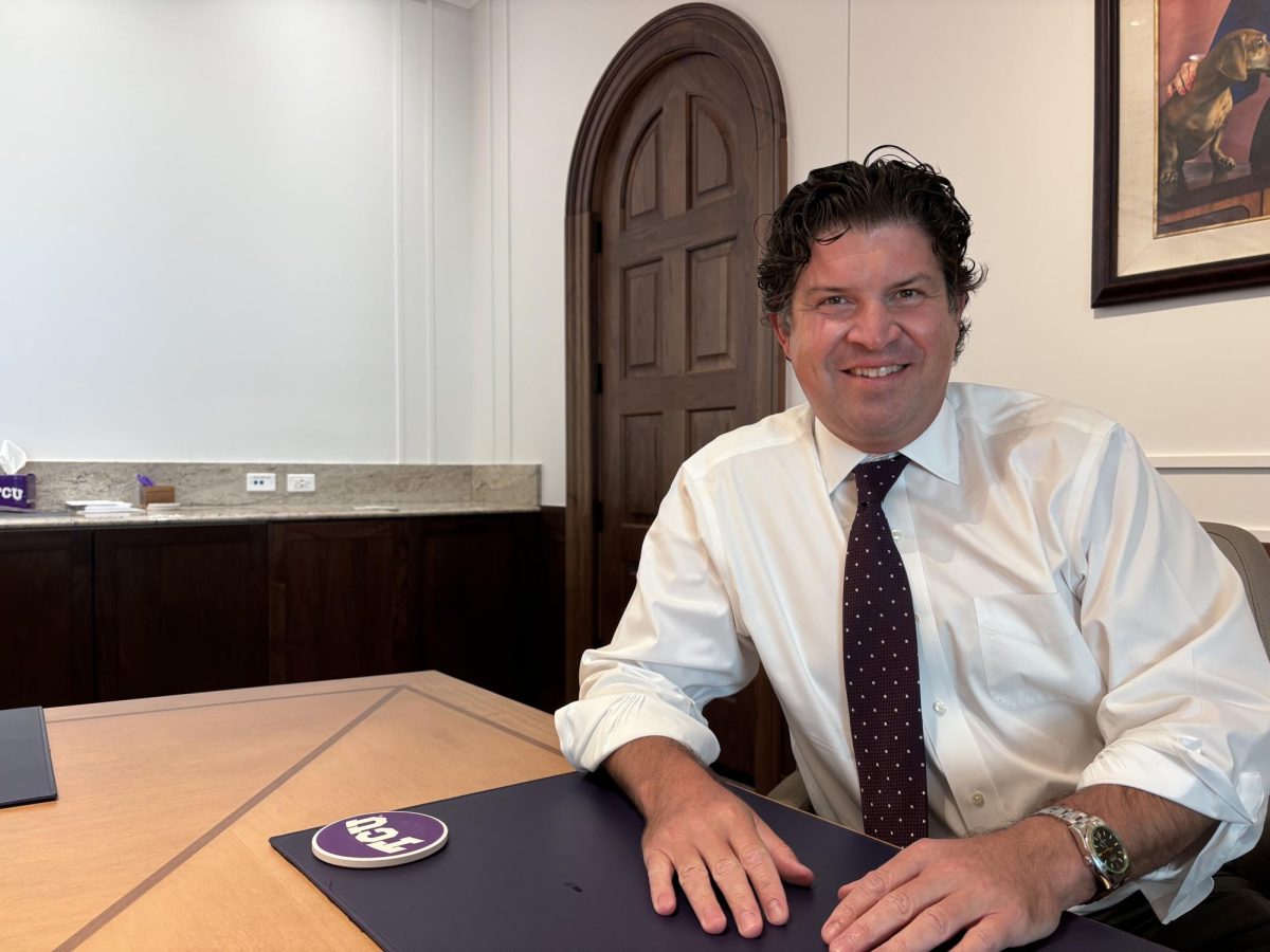 TCU President Daniel Pullin smiles for a photo in a boardroom at the Harrison building on campus on September 16, 2024.